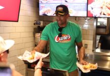 Al Horford hands out food to fans at Raising Cane’s in Boston