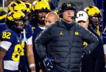 Jim Harbaugh stepped down as Michigan’s honorary captain for the opener