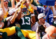 Packers’ WR Dontayvion Wicks works to stop the drops