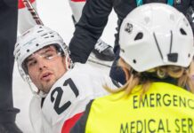 Switzerland’s Fiala leaves ice on stretcher with leg injury