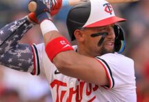 Twins scratch Lewis as precaution with right side tightness