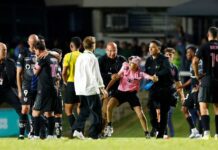 Lionel Messi knocked to ground during pitch invasion in Puerto Rico