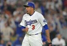 Diaz thrills Dodger Stadium with trumpet entrance, first save