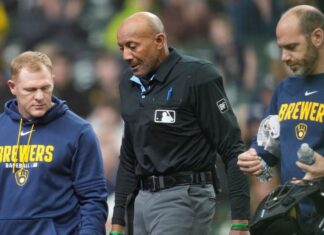Umpire Bucknor leaves Rays-Brewers after foul tip hits mask